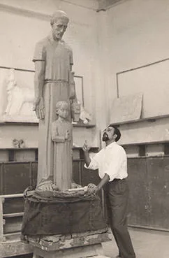 Gamal El-Sagini in the studio beside a monumental statue